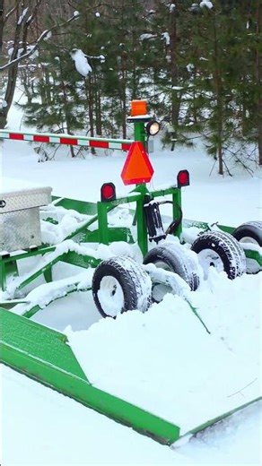 John Deere 740 Pulling A Snowmobile Trail Groomer In Michigan
