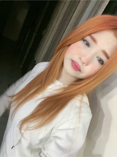 Captivating Indoor Portrait with Orange Hair