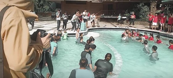 Team Building Activity - Hula hoop relay on pool