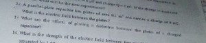 A parallel-plate capacitor has plates of area 0.1 m² and carrie... | Filo