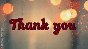 Red sign that says "Thank You" in white letters. The sign is surrounded by a blurry background