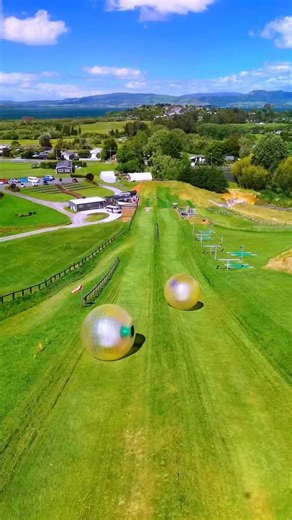 George & Crissa Prieto | Adventure Travel Couple on Instagram: "Who would you ride this with?! 🎢 details 👇l 🤗 Send this to your travel buddy! 📍Rotorua New Zealand @zorb.rotorua 🐹 Did you know you can roll down a massive hill inside a giant inflatable ball in New Zealand?! ZORB is one of New Zealand’s most iconic bucket list experiences. Spinning, bouncing, and laughing your way downhill in a transparent orb. It basically feels like you’re in a hamster ball water slide. 😂 🏷️ Price: We did 