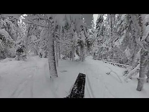 Electric snowmobile (track sled) in deep snow
