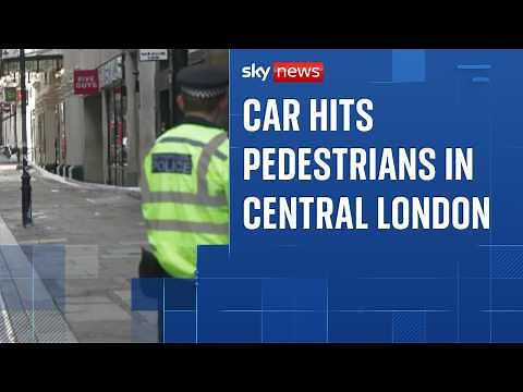 Woman arrested after car hits three pedestrians
