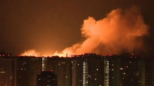Footage filmed by a Sky News camera crew shows a huge blast in Ukraine's capital lighting up the dark sky.