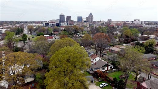neighborhoods and homes in suburbs of greensboro nc, north carolina aerial treetop pullout