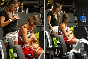 Basketball player Gonzalez breastfeeds her baby at half-time of match