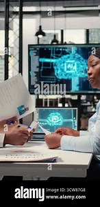Vertical Video Hiring manager and team use virtual assistant tools powered by AI, machine learning and neural networks to evaluate interview results, CV filtering and assist in selecting talent Stock Video Footage - Alamy