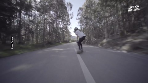Female downhill longboarder races through Portugal roads