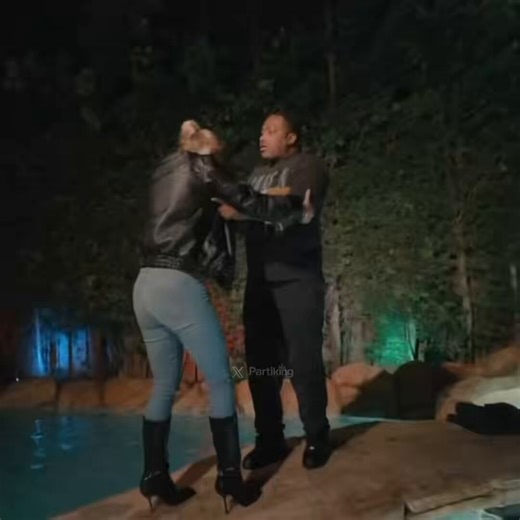 Adrien Broner throws fully clothed girl into the pool with her phone and wallet still on her😭