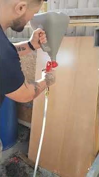 Hopper gun spraying Silicone render