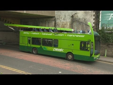 Roof ripped off double decker bus in railway bridge crash