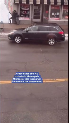 anti-ICE protester in Minneapolis, Minnesota, tries to run away from federal law enforcement
