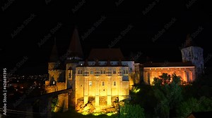 Summer thunderstrike storm at the medieval architecture Corvin (Hunyad) Castle in Hunedoara. 4k video with thunderstorm sky over Corvinilor Castle (in Romanian language).
