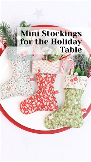 Lisa Cox / A Spoonful of Sugar Designs Sewing Patterns on Instagram: "These sweet Scrappy Mini Stockings are a festive favourite in our home! For this trio, I used the charming Tilda Merry Little Christmas fabric—one print for the exterior, another for the lining, and a third for the cuff. I added a folded ribbon tag above the heel and a hanging loop so they’re ready to adorn your tree, gifts, or holiday table. ✨ Want to turn them into an Advent calendar? Pair them with our free Threaded Tokens 