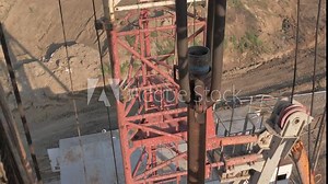 Onshore installation in the oil and gas industry. The top drive system of a drilling rig.
