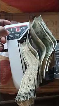 Money counting machine.
