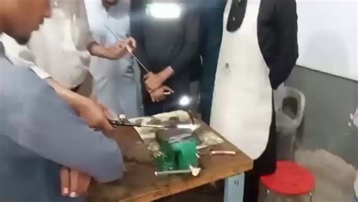 instructor demonstrating copper pipe brazing to student