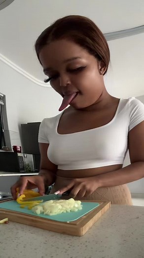 Chopping Vegetables in a Modern Kitchen Setting