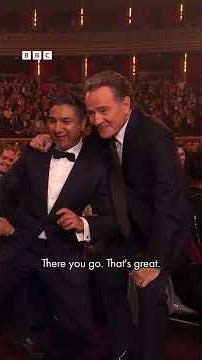 Nick Mohammed ropes Tom Hiddleston in to snap a photo with Bryan Cranston at the Olivier Awards⁣