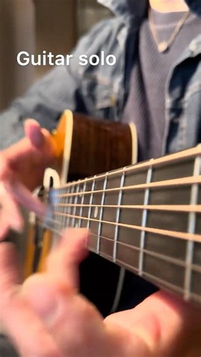 Playing guitar, bass, and drum solos all on a single acoustic guitar.