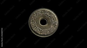 Rotating obverse of Japan 10 sen 1927 with inscription meaning JAPAN 2ND YEAR OF SHOWA. Isolated in black background.