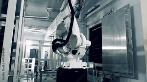 Factory robot is transporting solar panels onto the shelves