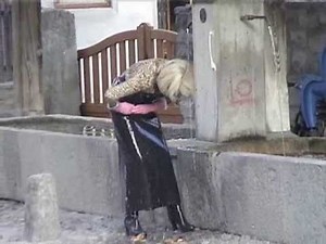 helga in wet rubber apron