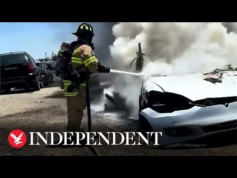 Tesla goes up in flames as firefighters struggle to extinguish battery