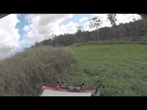 Tractor Slashing a Slope on a Hill Side