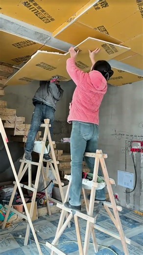 The process of installing drywall as a flat square ceiling covering #construction #viralshorts