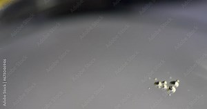 Oil drips into oily liquid of dark. Engine oil leaking concept