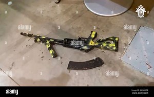 In this photo taken from video released by Investigative Committee of Russia on Saturday, March 23, 2024, a Kalashnikov assault rifle lies on the ground as Investigators from the Investigative Committee of Russia together with the operational units of the Ministry of Internal Affairs and the FSB, work the scene after an attack on the building of the Crocus City Hall on the western edge of Moscow, Russia. Several gunmen burst into a big concert hall in Moscow and fired automatic weapons at the cr