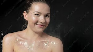 A model having fun during a photo shoot gives an authentic smile and laugh.