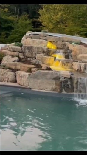 Swimming pool waterfall ‪@deckerspondscapes9291‬