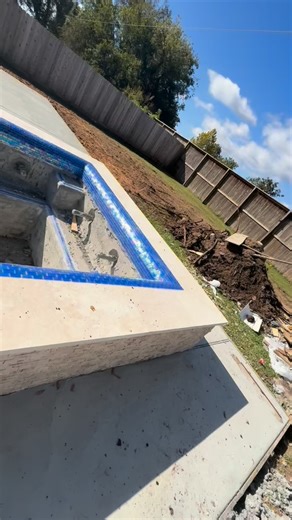 We’re loving this tile on the rolled edge paired with that beautiful stacked-stone spillway  Time to knock out our cleanups and get this pool ready for that beautiful Signature Matrix Blue Surf pebble  Call us today to start your design & build!  7138570771 Southern Texas Pools won’t let you down ✅ #designsbystevengarcia #southerntexaspools #houstonpools #custompoolbuilder #poolvibes | Southern Texas Pools | Facebook