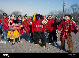 Posed group photo of Ecuadorian dancers & musicians at Flushing Meadows Corona park for a video shoot. In Queens, New York City, a very diverse place Stock Photo - Alamy