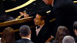 Rami Malek falls off stage at Oscars
