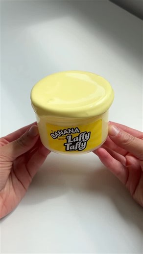 WWW.GLITTERSLIMES.COM on Instagram: "banana laffy taffy 🍌 thick, chewy, and glossy texture slime. basic but a classsic ✨ scented just like banana taffy (the best flavor)"