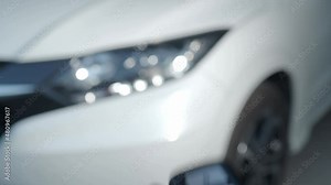 Car key remote control. Locking and unlocking the car by the car key remote control. Pressing the button of the car key and the lights blink when door opens or closed. Man hand using auto remote key.