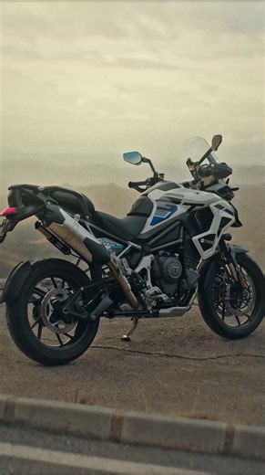 Introducing the New Tiger 1200 Alpine Edition. View the bike here: https://bit.ly/3YoDV1O The ultimate road-focused Tiger 1200. A 20L fuel tank for long-distance touring, refined Alpine styling, and advanced rider assistance, including Blind Spot Assist and Lane Change Assist. Built for comfort, confidence, and serious adventure miles. | Triumph Motorcycles South Africa