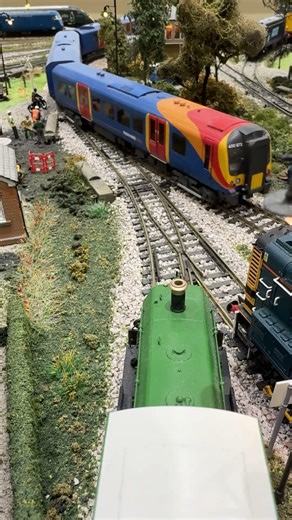 450073 passes the shunters.