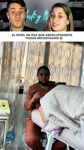 Young woman gets so relaxed during her facial massage that she ends up falling off the massage ta...