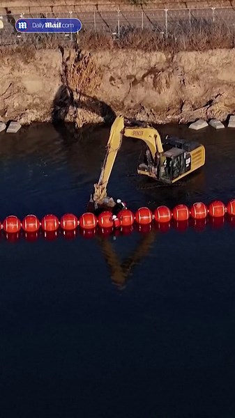 Drone video shows buoys barrier going up at US-Mexico border river