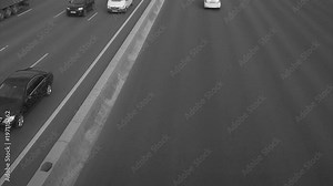 car traffic on a wide highway black and white timelapse