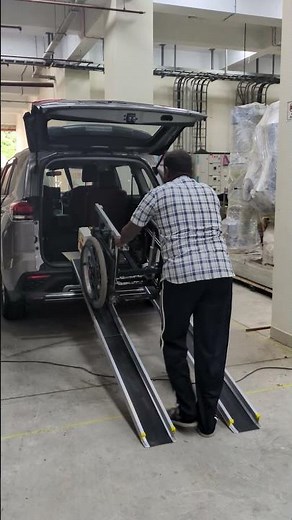 Foldable lightweight ramp for loading wheelchair into rear hatch of car