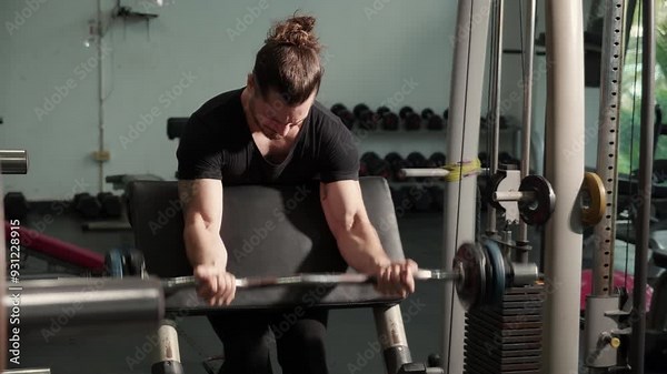 Young caucasian man work out in fitness gym with motivation and determination, man lifting weights with strong and strength, man practice lifting barbell with endurance, sport concept.