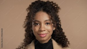 Biracial woman disapproving signal with no head sign, nods head rejectingly.