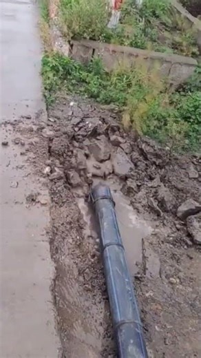 the process of installing or pulling large electrical cables to be buried underground or underground