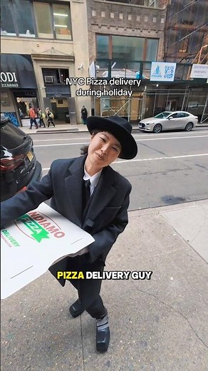 Pizza delivery guy in NYC so fancy dressed during holiday! I am obsessed!